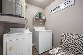 laundry room with a washer and dryer at Artisan Apartments & Shops, Texas